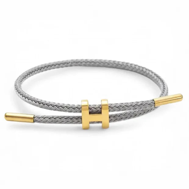 Elegant Flätat Armband med Guld H Spänne