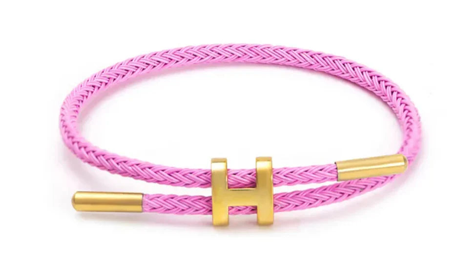 Elegant Flätat Armband med Guld H Spänne